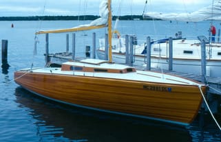 feather boat on the water