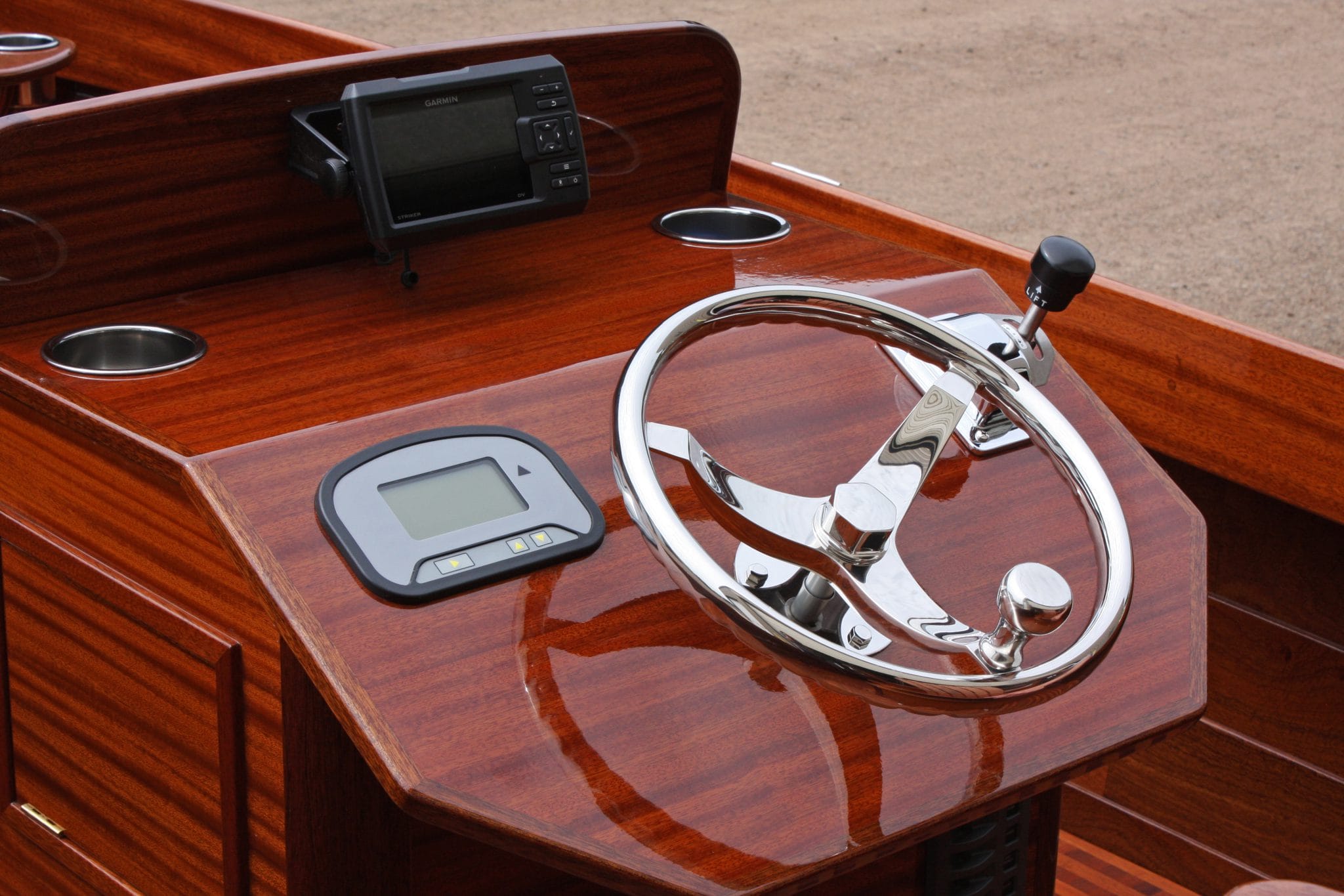 Mahogany console with stainless steering wheel on 16' fishing boat, Geepy