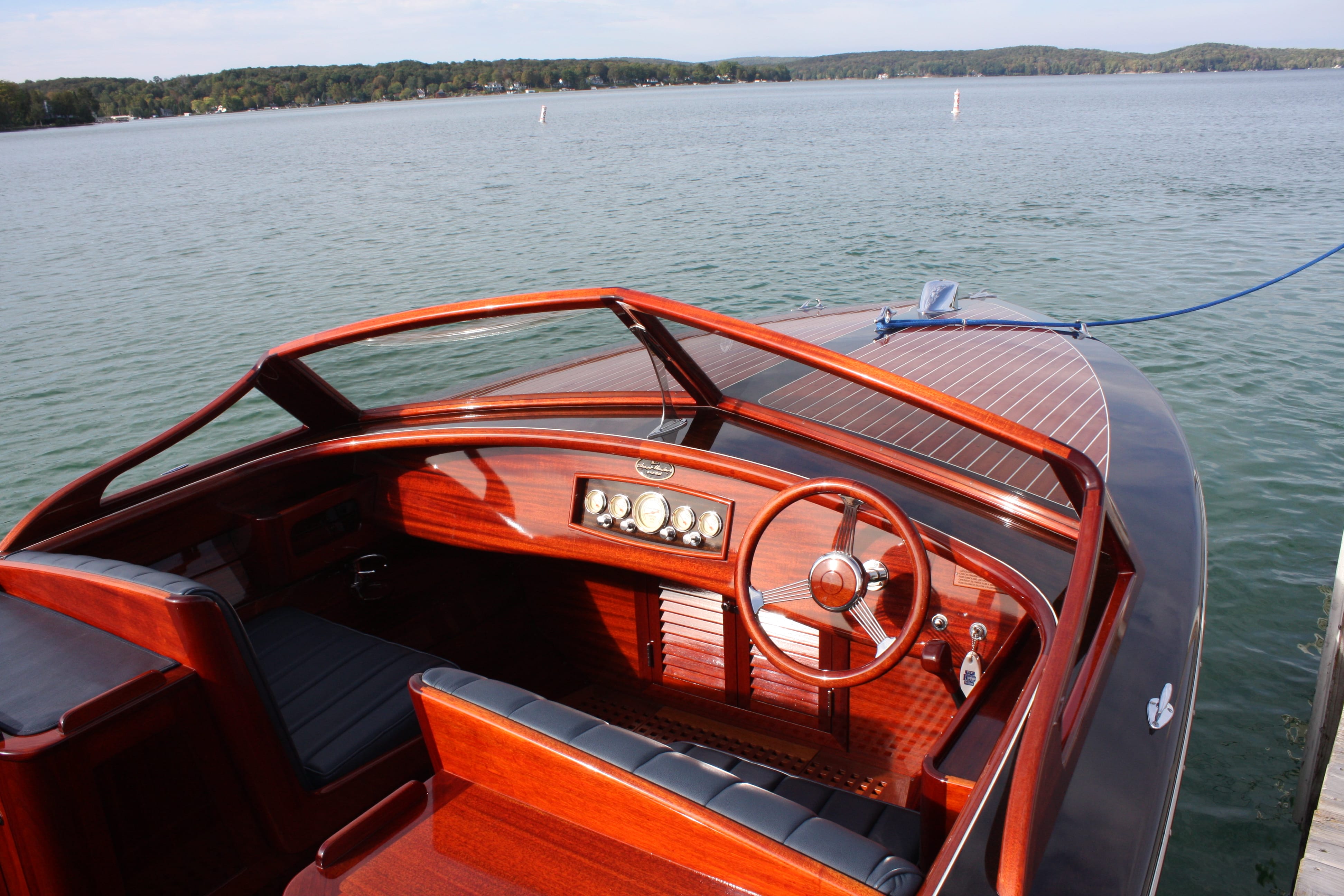 Helm of pristine custom made mahogany boat, After Five