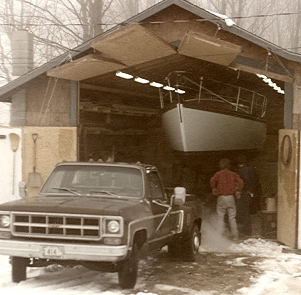 The team working on a boat in the original shop.