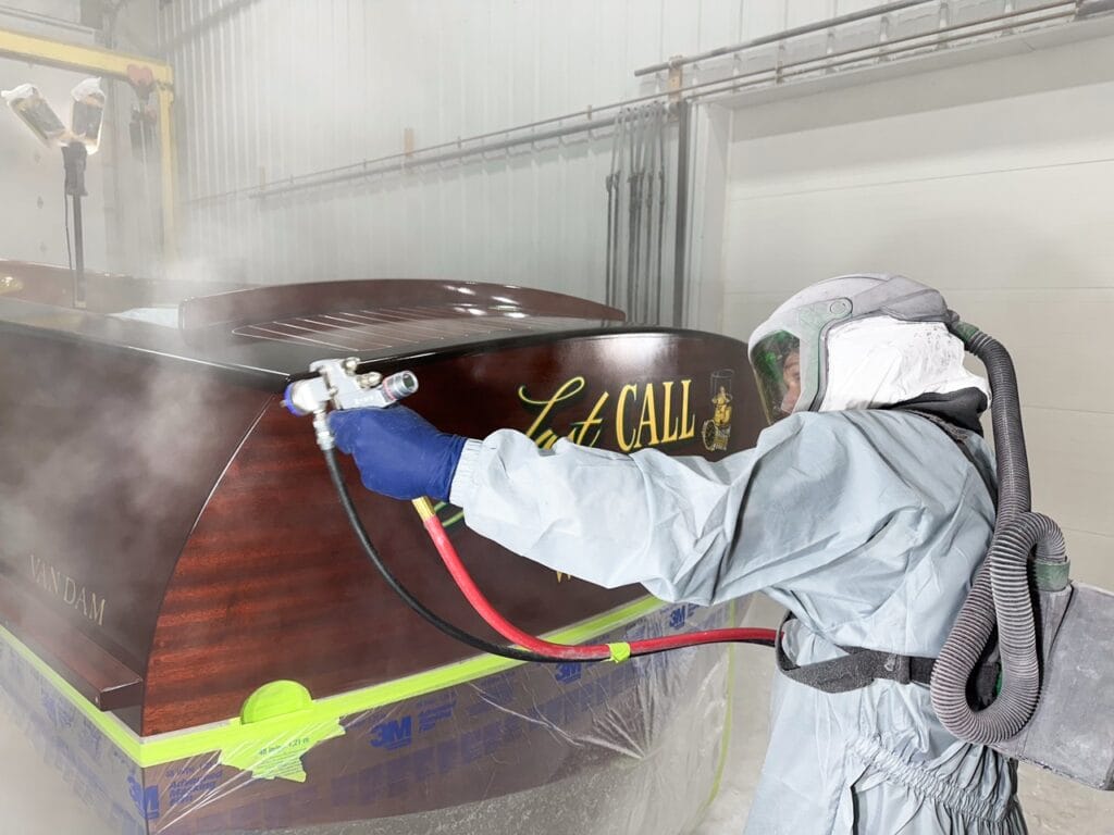 Craftsman applying clear coat to LAST CALL